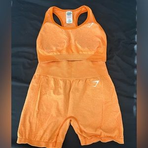 Gymshark vital seamless orange marl shorts and sports bra.